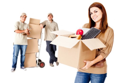 Packed office boxes and furniture ready for removal