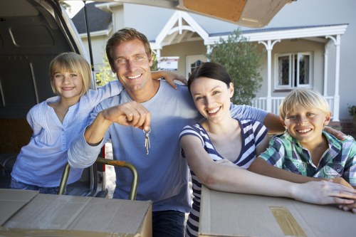 Professional movers loading items into a removal van in Fulham