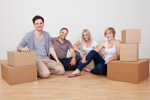 A mover handling household items carefully during a Fulham move